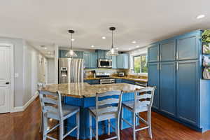 So much counter space in this kitchen with this extra large island with granite countertops.