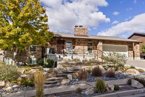 Xeriscaped terraced front yard BOASTING IMMENSE CURB APPEAL! Low Maintenance and Low water usage with auto drip system in place.