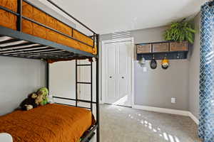 Newly Carpeted bedroom and lots of built in storage in the closet and a large window.