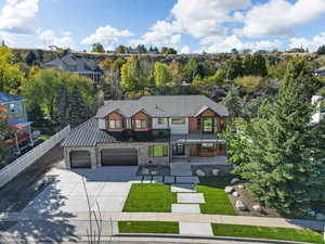 View of front of home featuring a garage and a front lawn