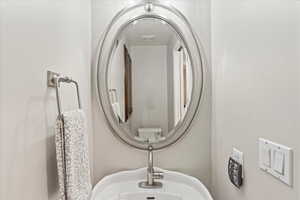 Powder room near garage entrance.