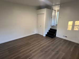 Unfurnished room featuring dark hardwood / wood-style floors