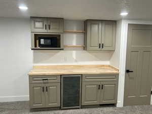 Family room bar with fridge and microwave