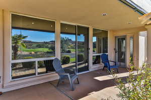 Covered Patio with Slider from Living Room and Walk Through Door From Dining