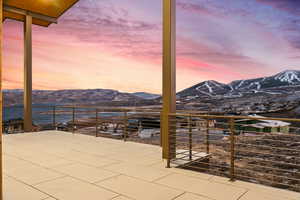 Patio terrace at dusk with a mountain view