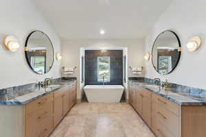 Bathroom featuring vanity and a bathing tub