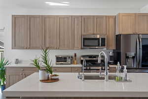 Kitchen featuring stainless steel appliances and sink