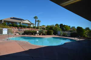 Outdoor swimming pool featuring a patio area