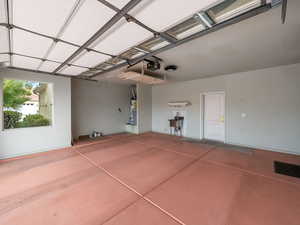 Garage with a garage door opener and water heater