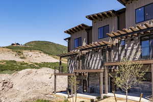 Your mountain escape starts here, with warm wood tones and a welcoming front porch made for hot cocoa.