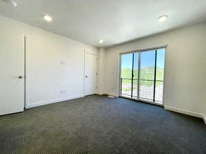 Spacious and serene primary suite with plenty of natural light.