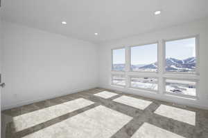 Carpeted spare room with a mountain view