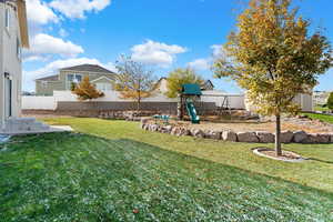 View of yard featuring a playground