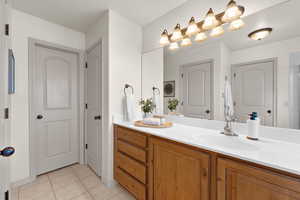 Bathroom featuring vanity and tile patterned floors