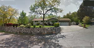 Single story home featuring a garage