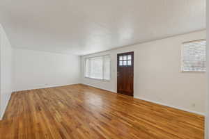 Foyer featuring hardwood / wood-style floors and a textured ceiling