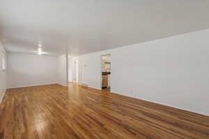 Unfurnished room with wood-type flooring and sink