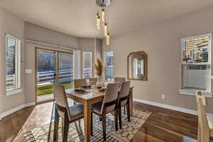 Dining room featuring dark wood-type flooring