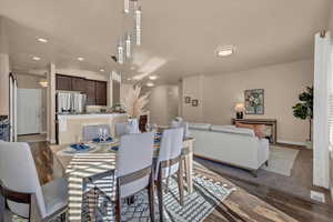 Dining area with dark hardwood / wood-style flooring