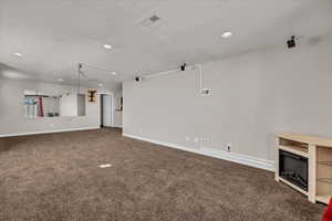 Unfurnished living room featuring carpet floors