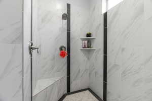 Bathroom with tiled shower