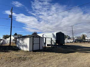 View of outdoor structure with a carport