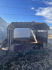 View of outdoor structure with a carport