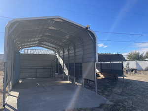 View of vehicle parking with a carport