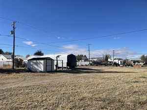 View of yard featuring a storage shed