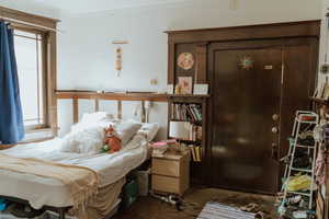 Bedroom featuring crown molding