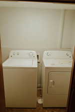 Washroom featuring washing machine and dryer