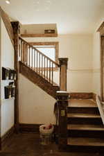 Stairway featuring wood-type flooring