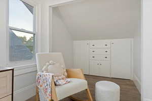 Bedroom with a nursery area, lots of natural lighting