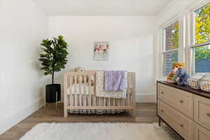 Bedroom with a nursery area, lots of natural lighting