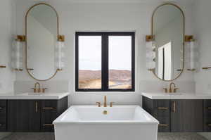 Bathroom with vanity, a tub, and a mountain view