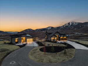 View of front of property featuring a mountain view and a garage