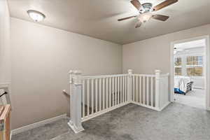 Hallway with carpet floors