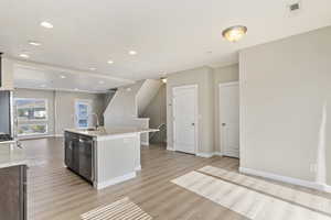 Dining area looking to kitchen and great room area