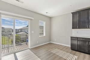 Dining area off kitchen with balcony