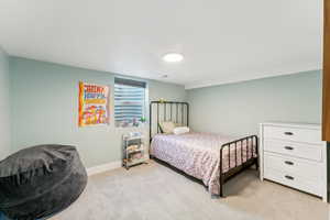 Bedroom with light colored carpet