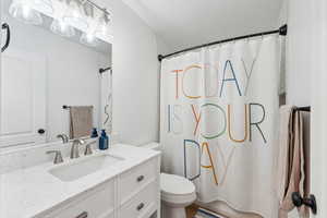 Bathroom with toilet and vanity