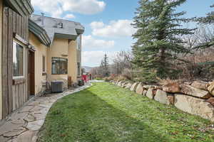 View of yard featuring central air condition unit