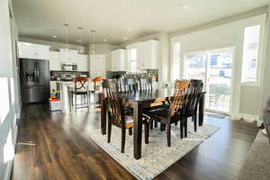 Dining space featuring dark hardwood / wood-style floors