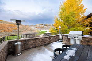 View of patio with an outdoor kitchen and grilling area