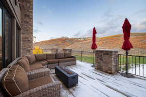 Wooden deck with an outdoor living space