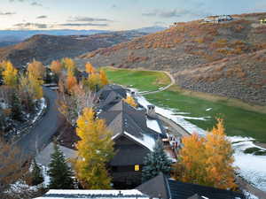 Aerial view at dusk featuring a mountain view