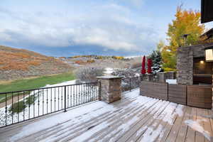 Wooden deck featuring a mountain view