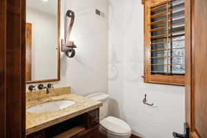 Bathroom with vanity and toilet