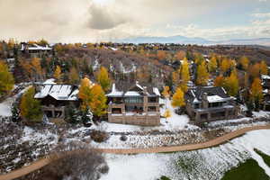 Snowy aerial view featuring a mountain view