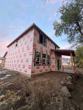 View of property exterior at dusk